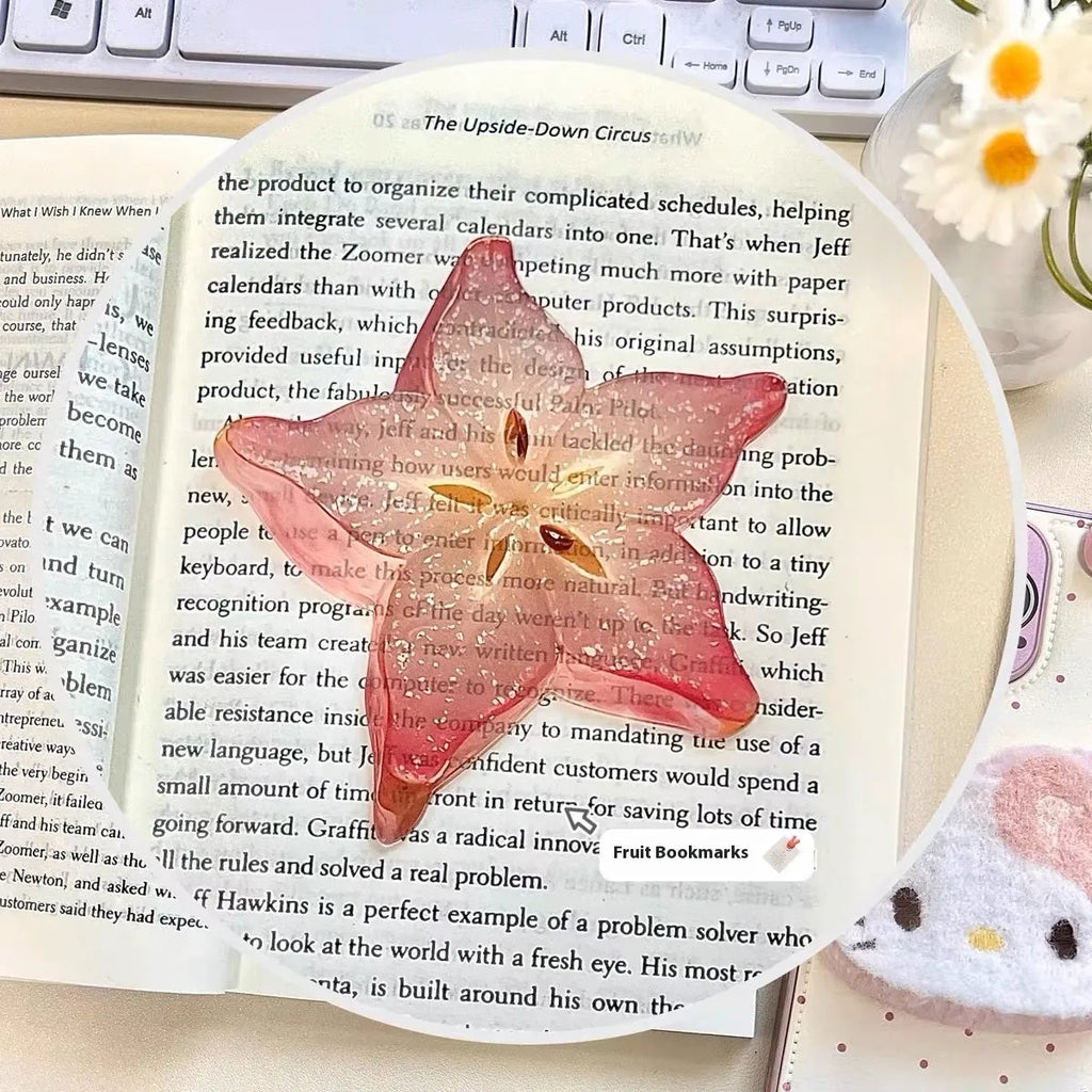 Cute transparent plastic fruit bookmark in watermelon red colour, approximately 8-10cm long, with a cartoon fruit shape.