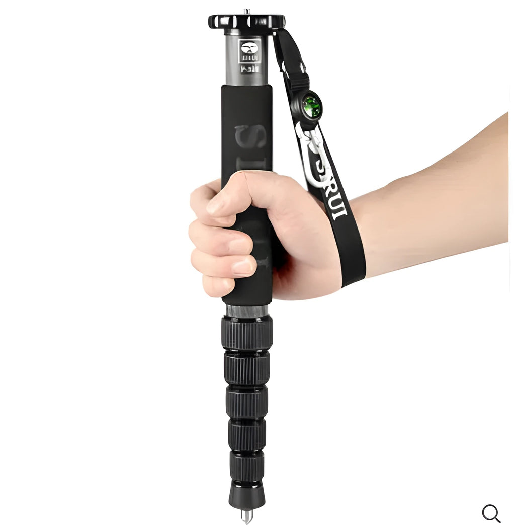 Black carbon fibre SLR camera monopod with telescoping legs extended.