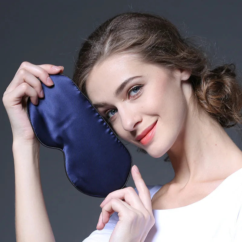 Double-sided mulberry silk eye mask with embroidery, shown in champagne colour, dimensions 22cm by 11cm.