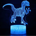 Colourful 3D dinosaur night light with LED glow on a square black plastic base.