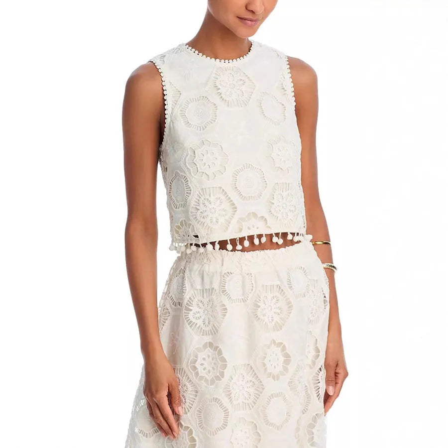 White women's retro style two-piece suit with sleeveless top, long skirt, and embroidery detail.