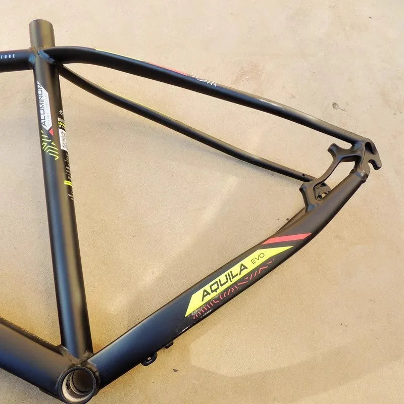 Black-green 29-inch aluminium mountain bike frame with innerline cable routing and disc brake mounts.