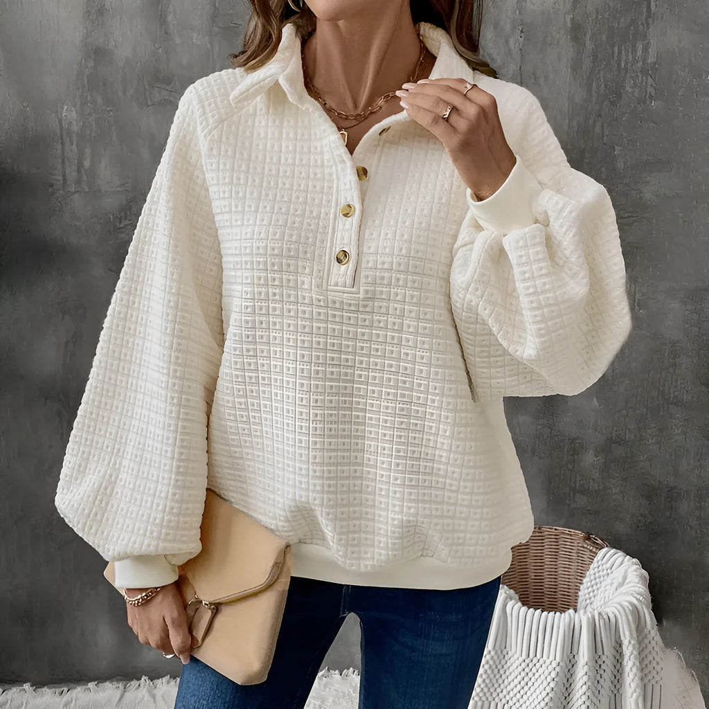 Women's milky white textured polo collar sweater on a hanger.