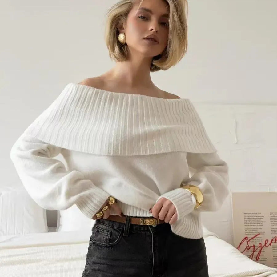 Grey off-the-shoulder sweater with a 3D textured pattern and regular sleeves on a model.