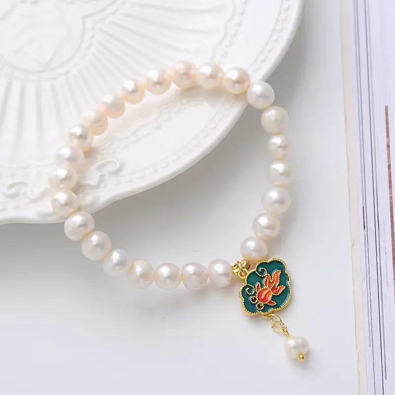 White freshwater pearl goldfish and lotus bracelet with vintage baroque design on delicate chain