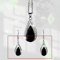 Black and red teardrop glass pendant necklace and matching alloy earrings set.