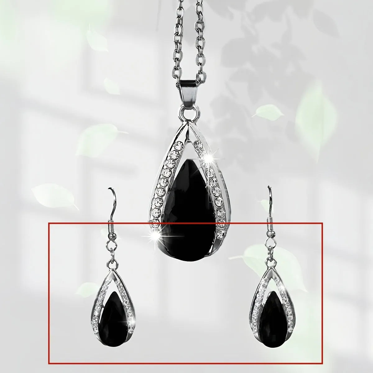 Black and red teardrop glass pendant necklace and matching alloy earrings set.