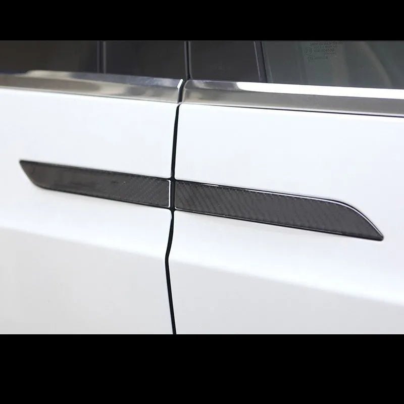 Four clear carbon fibre adhesive door handle protection patches for Tesla Model S interior.
