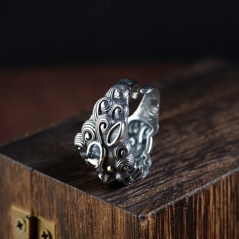 Silver open ring with detailed animal Jibeast pattern and geometric design