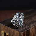 Silver open ring with detailed animal Jibeast pattern and geometric design