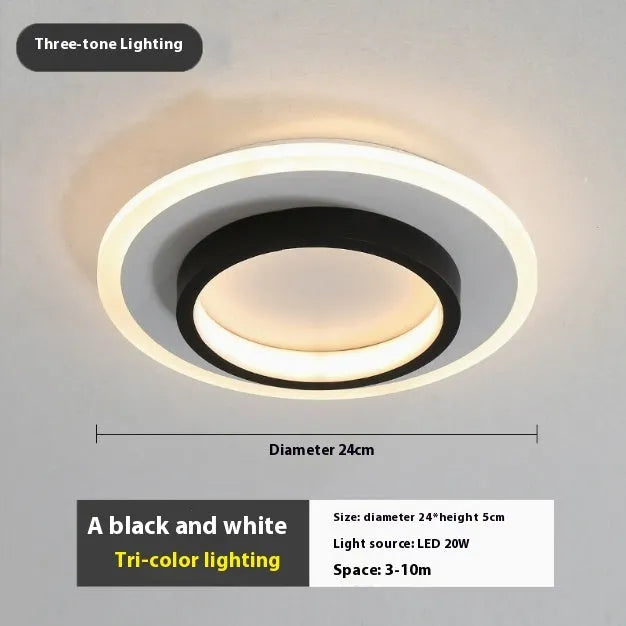 Black circular LED corridor light with aluminium and acrylic construction, 21cm diameter, for balcony or porch use