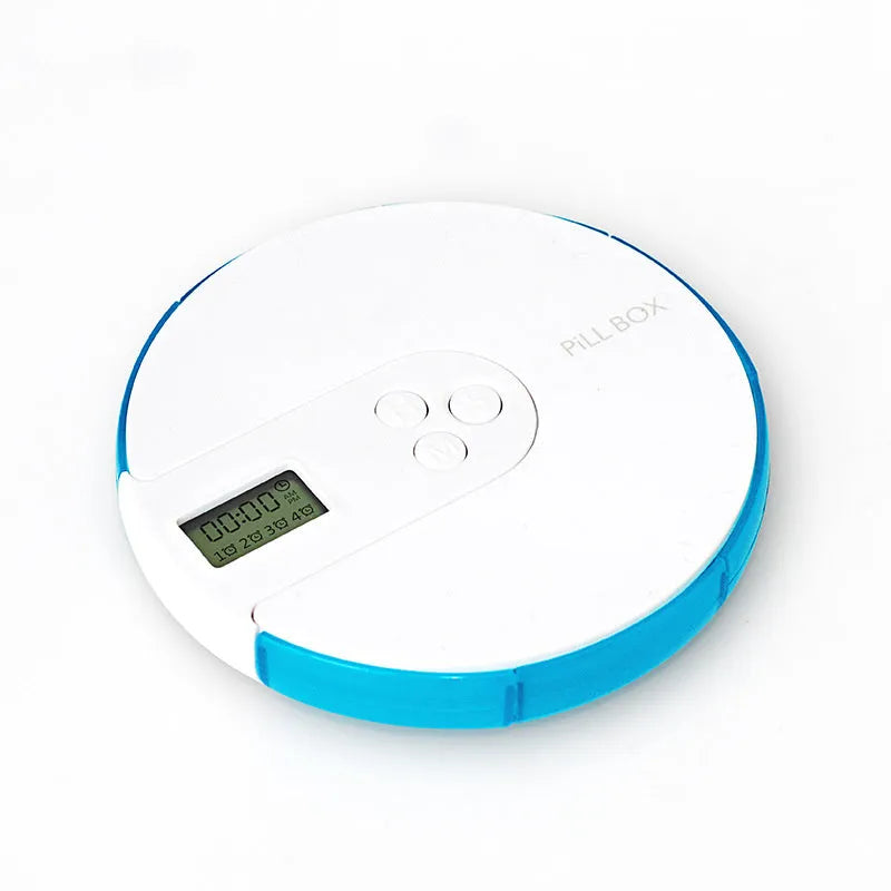Blue 7-compartment alarm clock pill dispenser showing time display and open compartments.