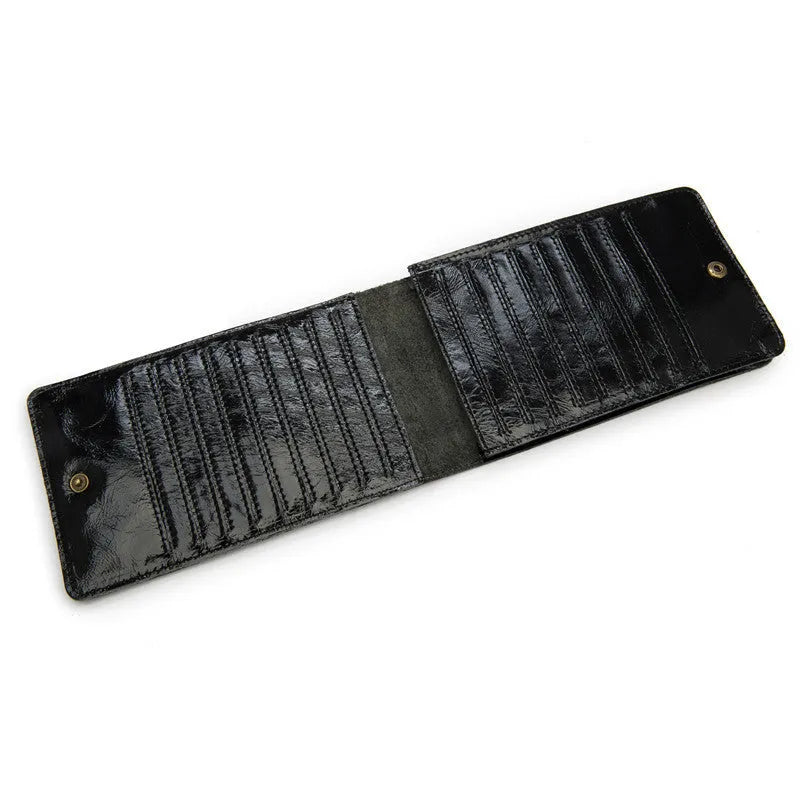 Slim black leather men's wallet open to show 18 card slots and a central mobile phone pocket.