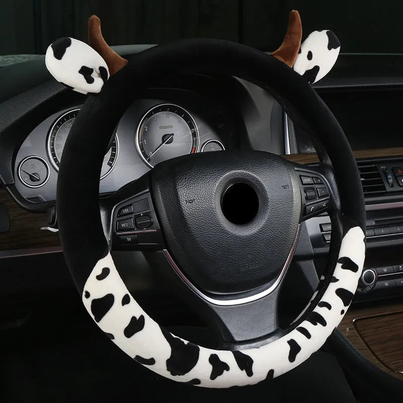 Black short plush automotive steering wheel cover showing protective handle feature