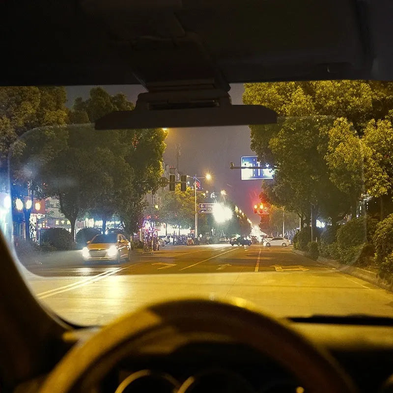 Car day and night sun goggles with reflective lenses on a sun visor, available in two sizes