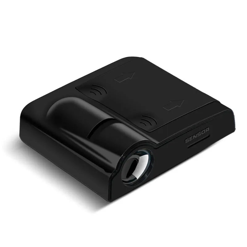 Compact black and beige ABS plastic car decorative projection radium lamp shown with AA batteries.
