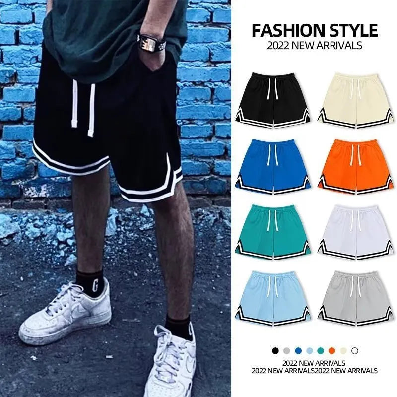 Men's loose-fit polyester summer shorts in various colours on a plain background.
