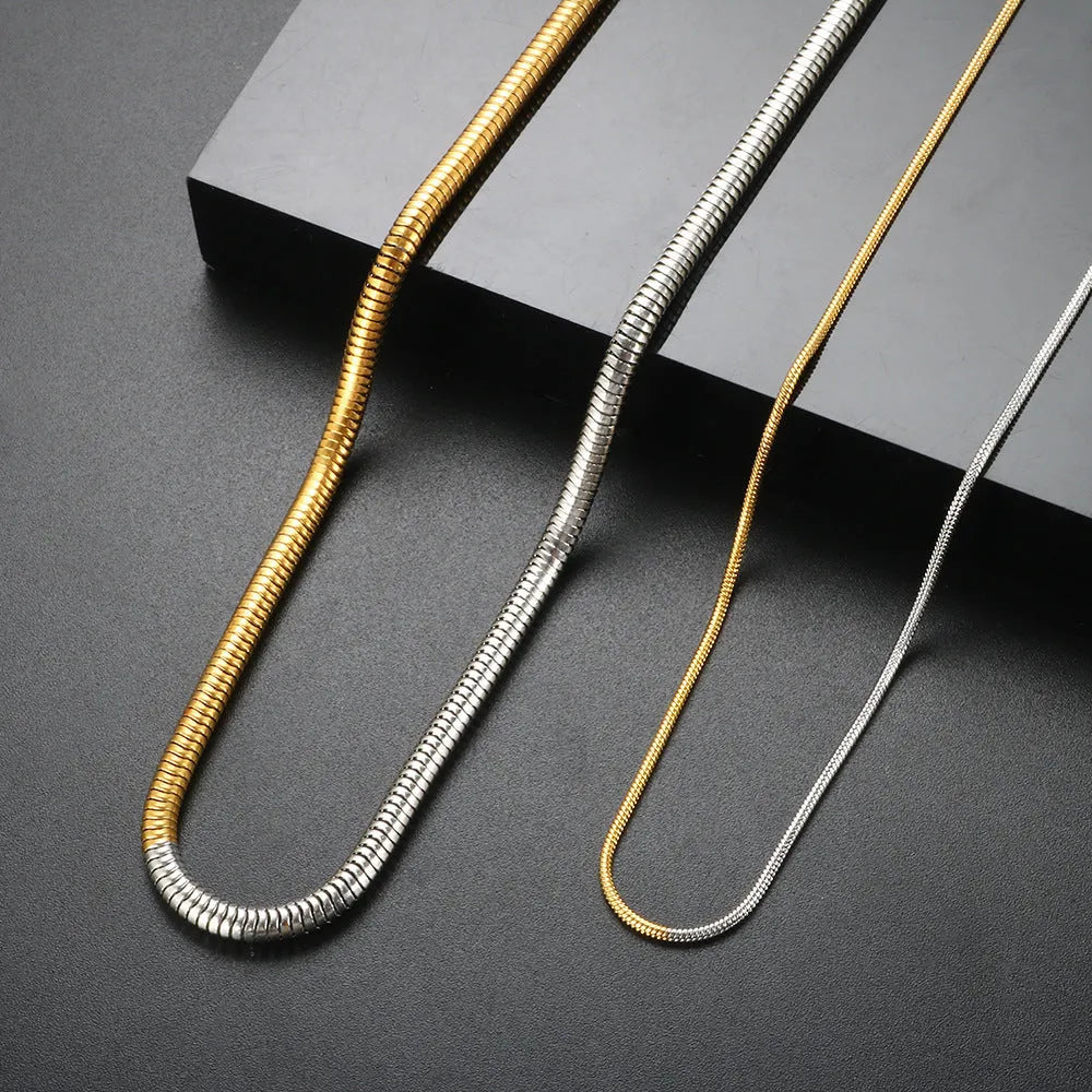 Women's cold golden 3mm wide stainless steel snake bones chain necklace, geometric design.
