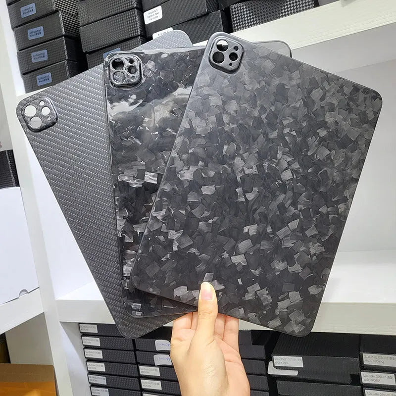 Genuine carbon fibre hard protective case for Apple iPad Pro 11 on a table.