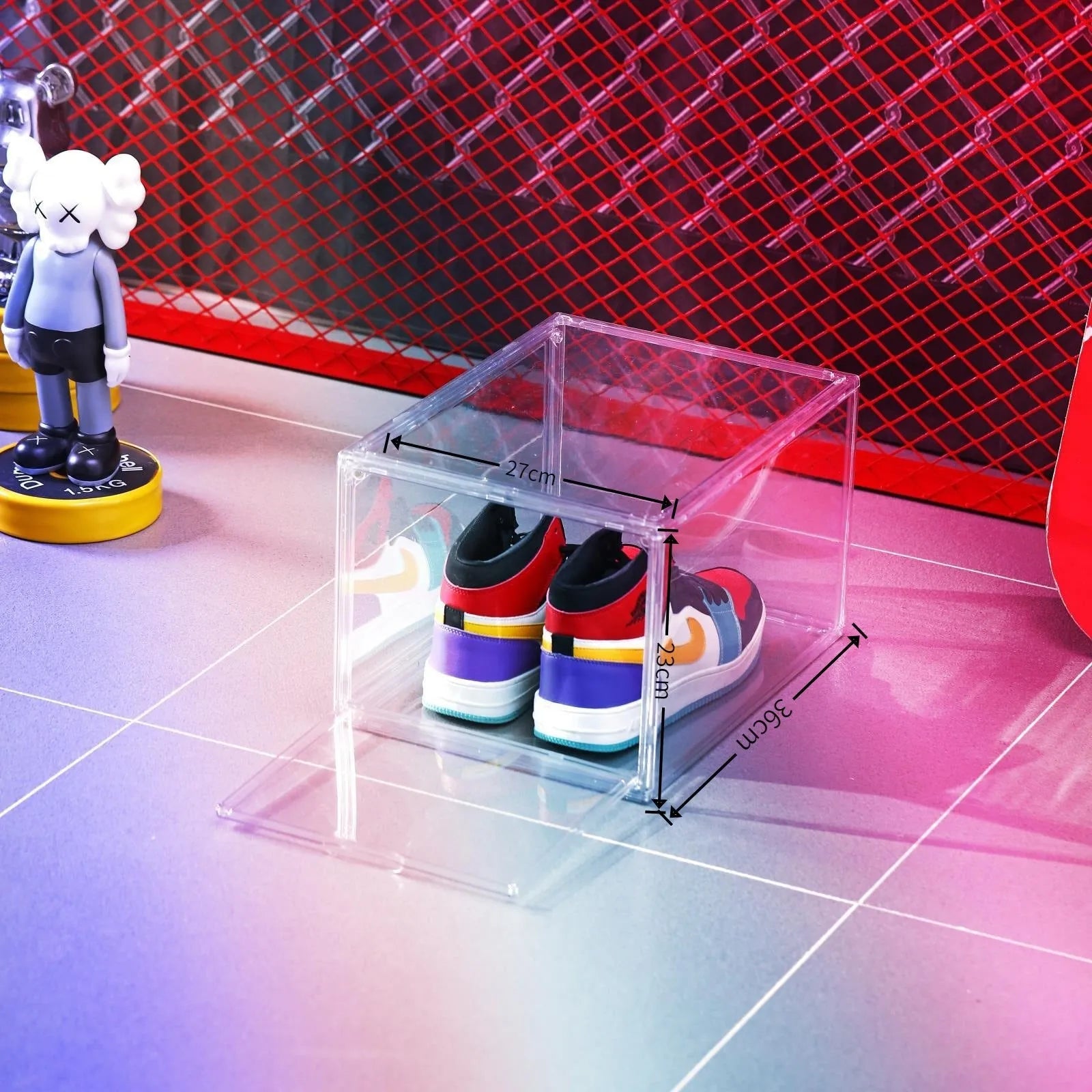 Large clear acrylic shoe storage box with a magnetic side door open, showing shoes inside.