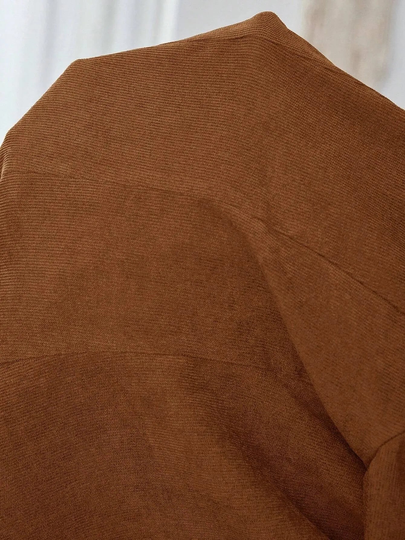 Brown single-breasted leisure suit coat with lapel collar and long sleeves