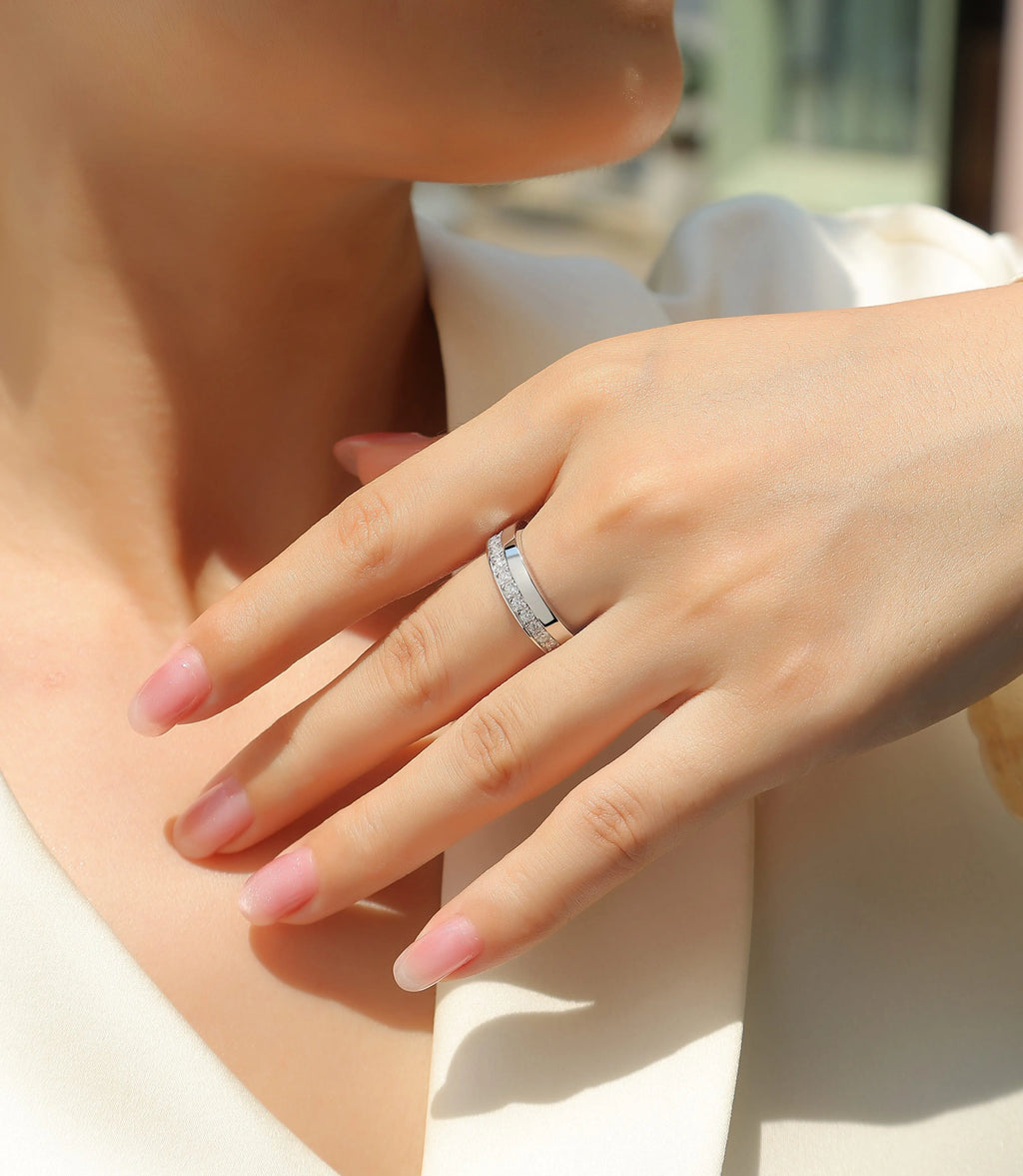 Moissanite wedding ring with gold-plated S925 silver setting on a white background