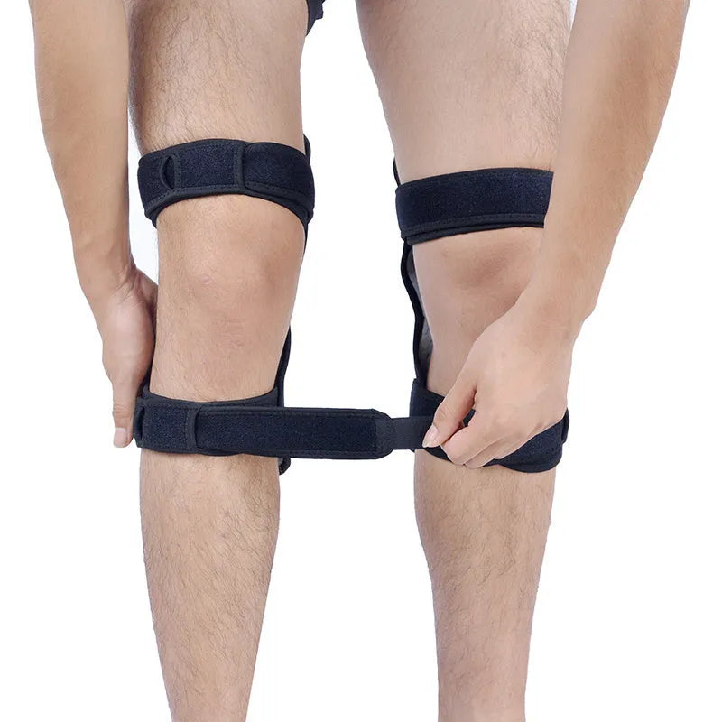 Black adjustable spring knee brace support for patella, shown on a knee with straps and venting holes.