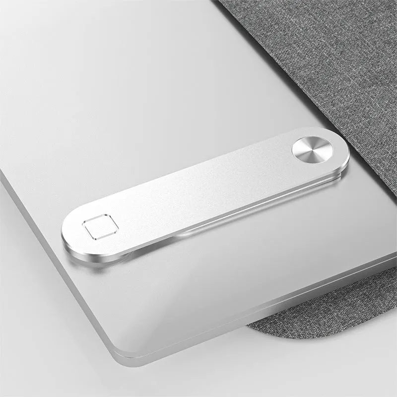 Black aluminum laptop phone holder with magnetic bracket mounted beside computer monitor