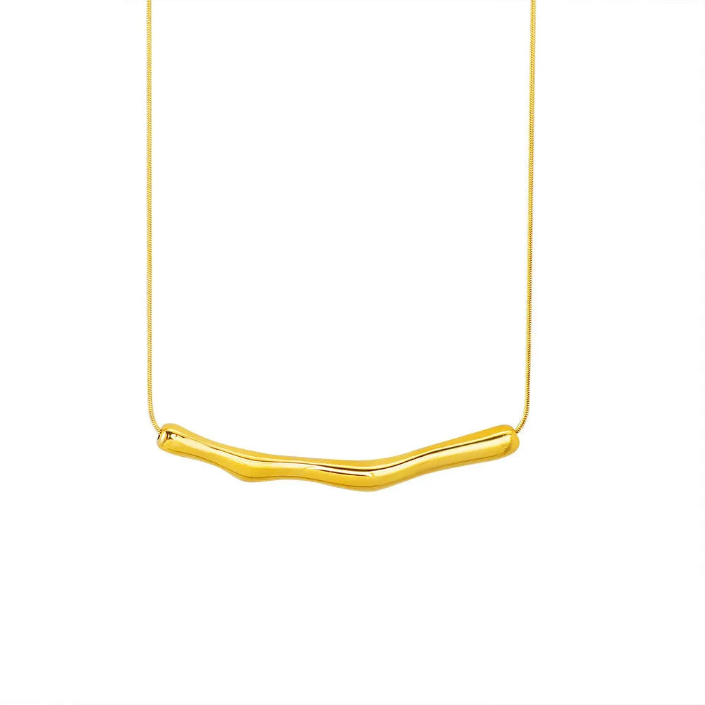 Close-up of a women's titanium steel necklace with an irregular pleated textured pendant in a gold tone.