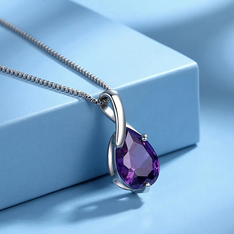 Sterling silver S925 pendant with amethyst stone and diamond-like accents on white background