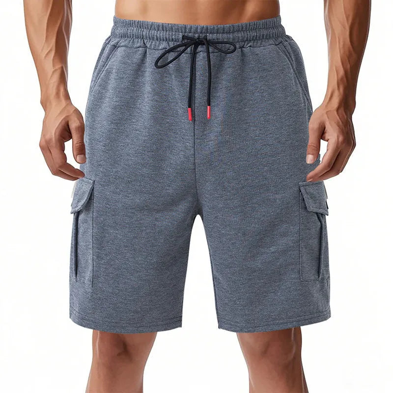 Heavy loose fit light gray cargo sports shorts made from terry fabric with multiple pockets.