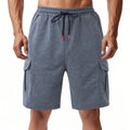 Heavy loose fit light gray cargo sports shorts made from terry fabric with multiple pockets.