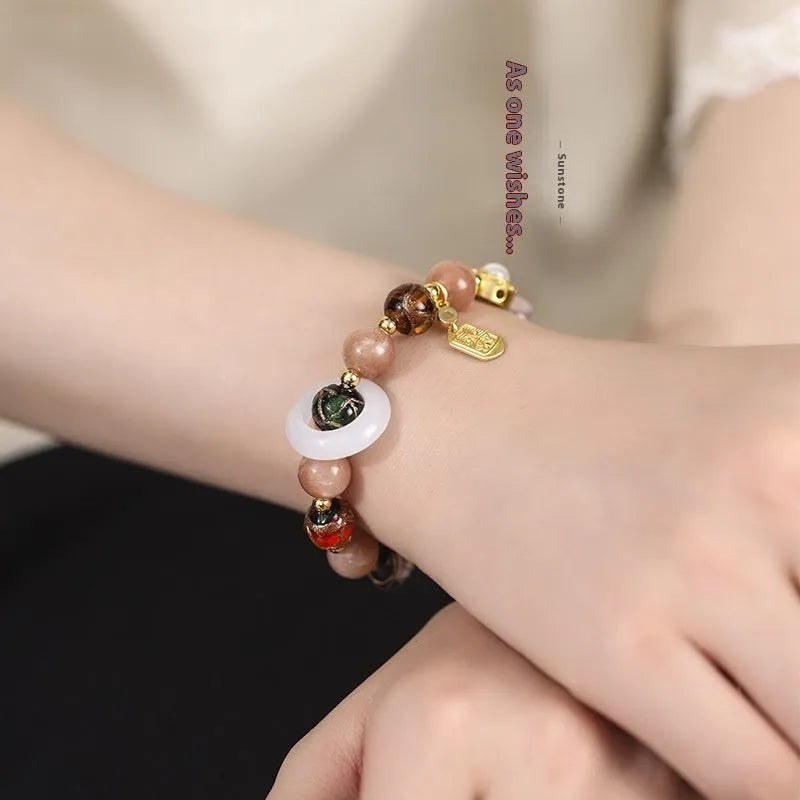 Hand-woven fragrant grey coloured glaze bracelet with sunstone, shell, and glass moon beads