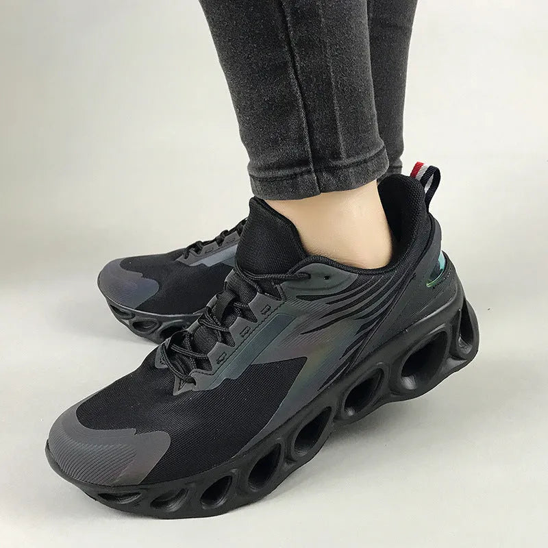 Men's low-top casual sports shoe in black mesh with white sole and lace-up front.