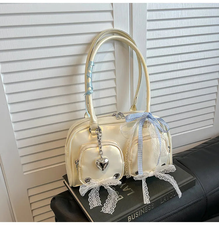 Beige PU shoulder bag with mobile phone pocket and double connector straps on horizontal square suitcase shape