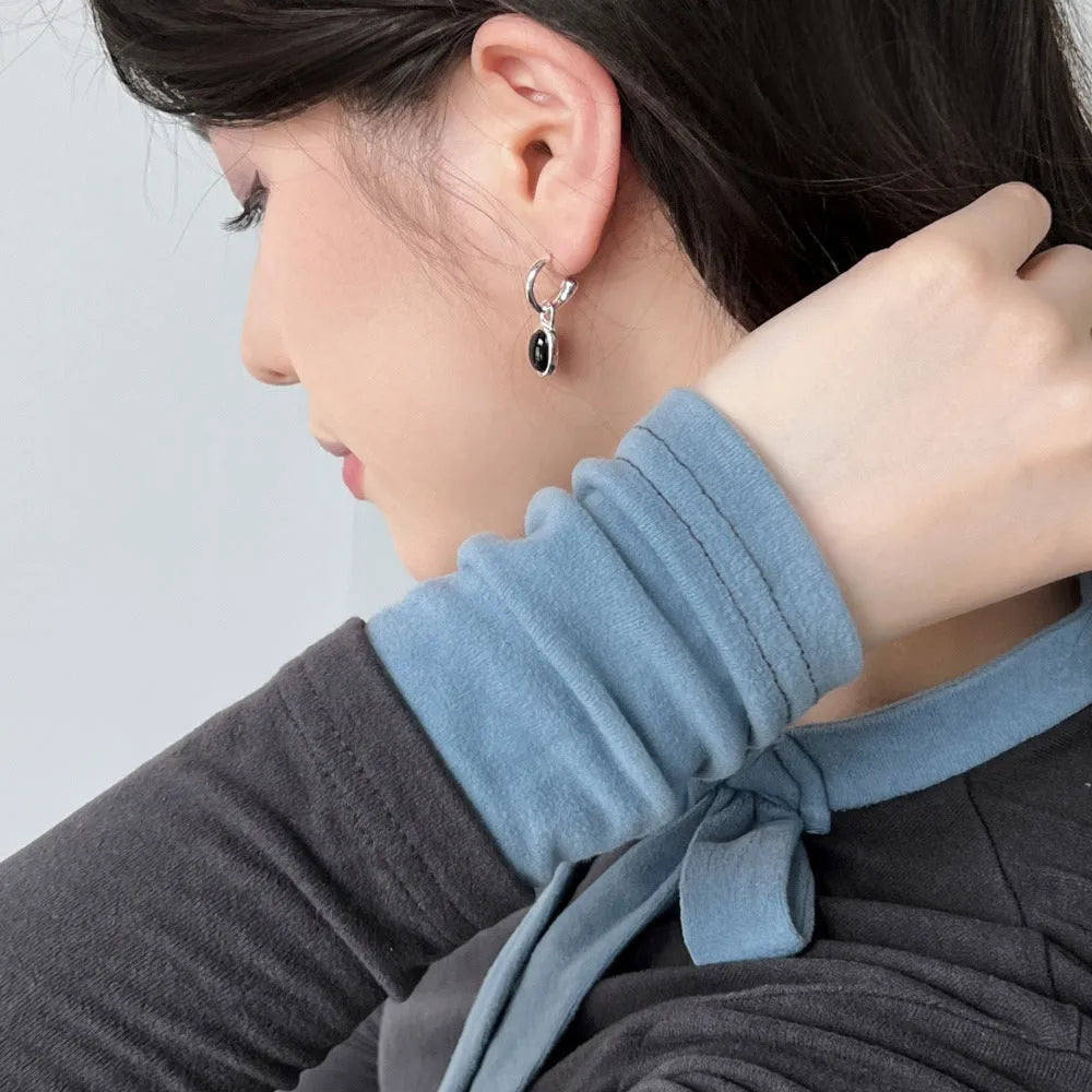 S925 sterling silver stud earrings for women with black agate and a geometric ellipse shape in silver