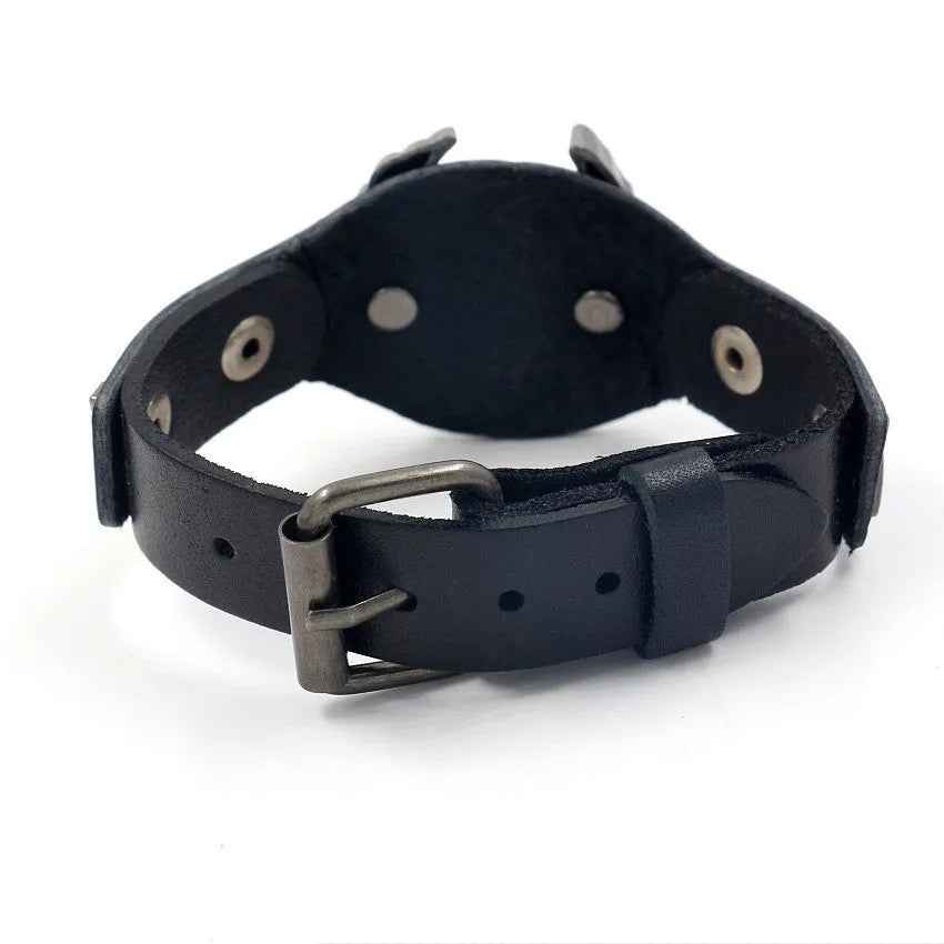 Black leather geometric bracelet with an eagle watch clasp, showing tapered width.