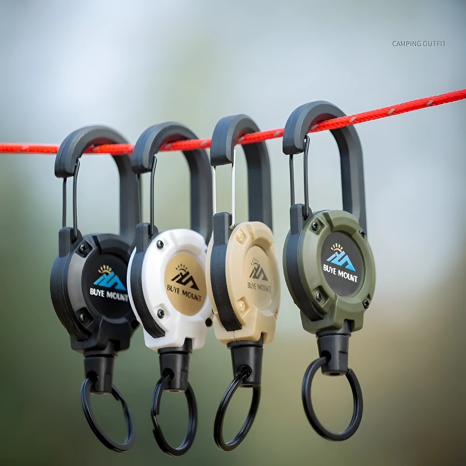 Retractable plastic buckle hook for outdoor camping in black against a green background