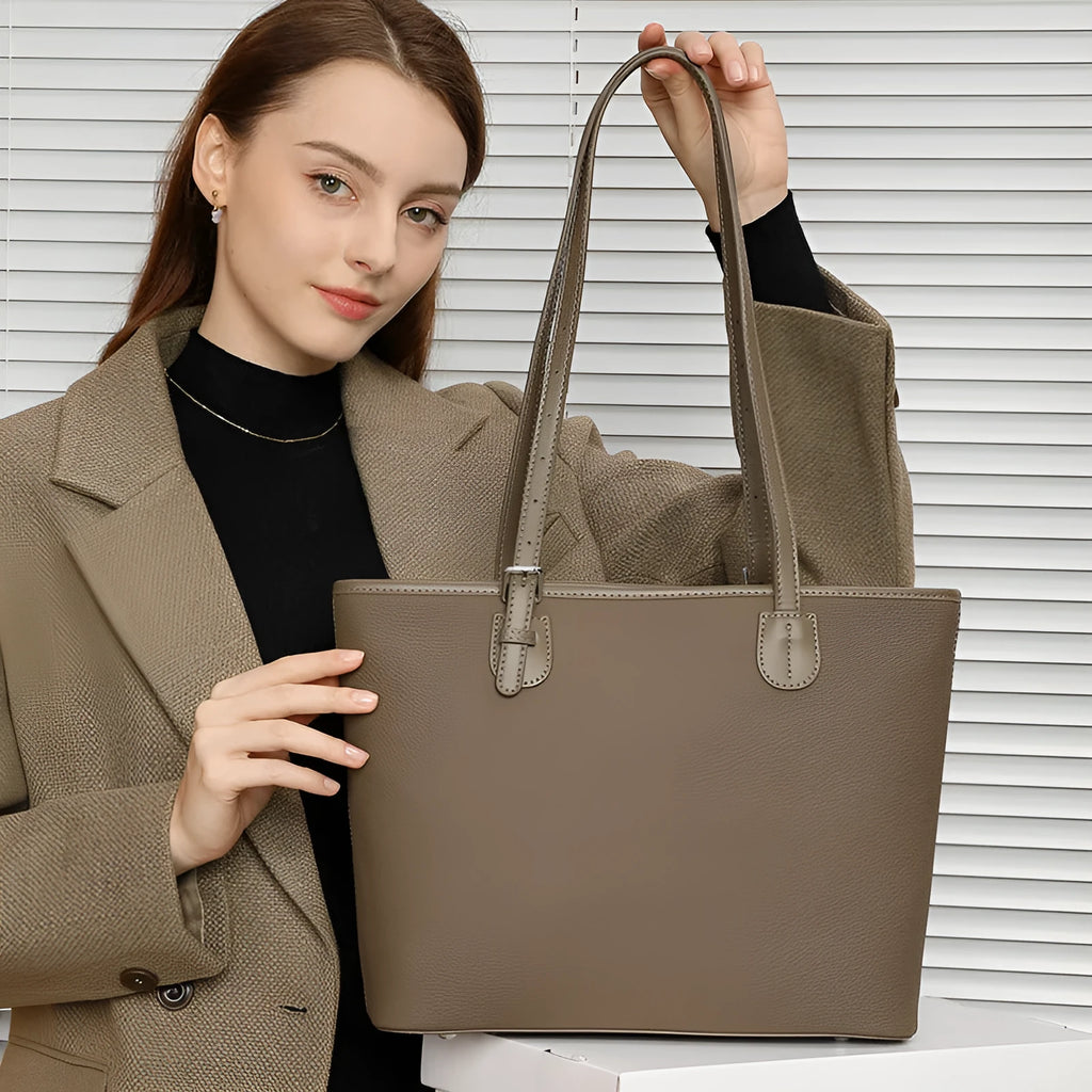 Women's genuine leather tote bag 30cm wide in black colour showing internal zipper compartments and retro styling
