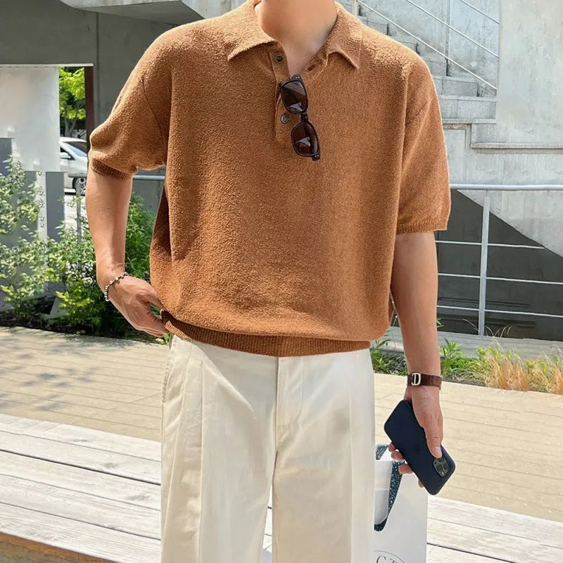 Men's caramel coloured loose fit knitted polo shirt with short sleeves and an asymmetrical design detail.