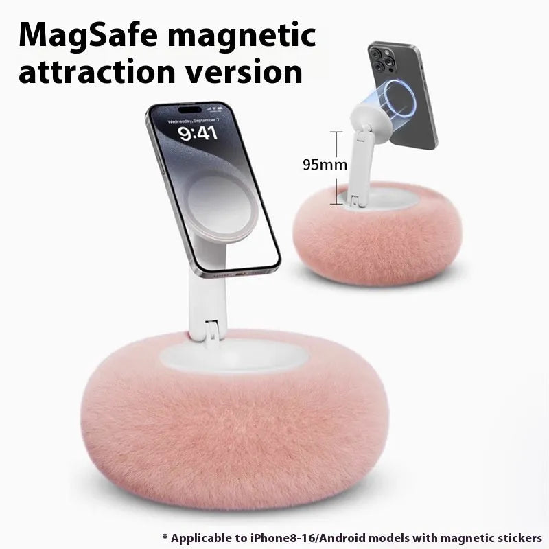 Magnetic mobile phone pillow bracket stand in pink, creamy-white, and khaki green on a bedside table