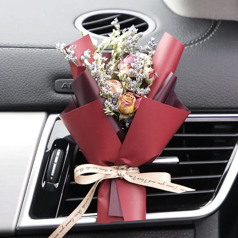 Dried flower car air freshener with natural aroma slices mounted on vehicle air conditioning vent