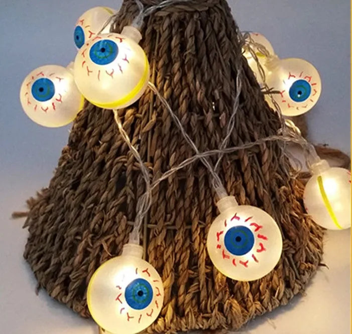 Halloween LED string lights with plastic pumpkin, ghost and bat decorations hanging on a 1.2 metre cable.