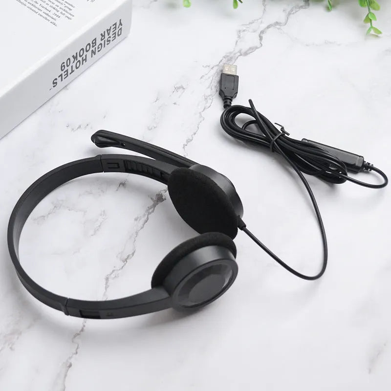 Black USB wired gaming headset with microphone, sponge ear pads and PVC cable for PC computer use
