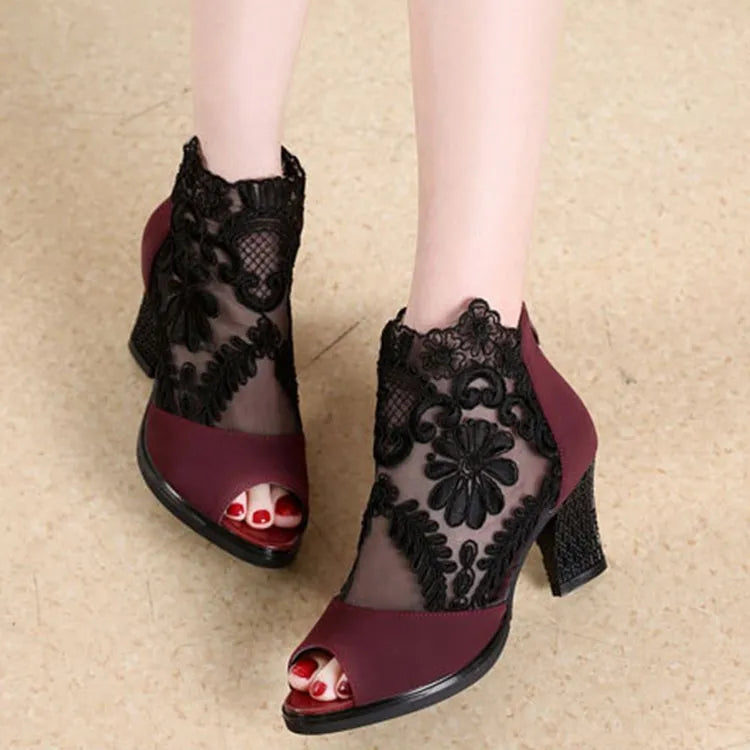 Black lace gladiator sandals for women with a square high heel, peep toe, and a zip closure.