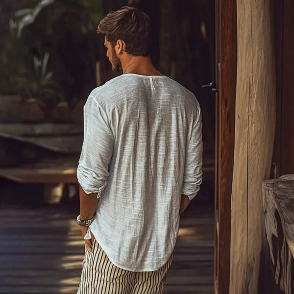 Beige V-neck long-sleeved t-shirt on hanger showing slim fit and hemp blend fabric texture