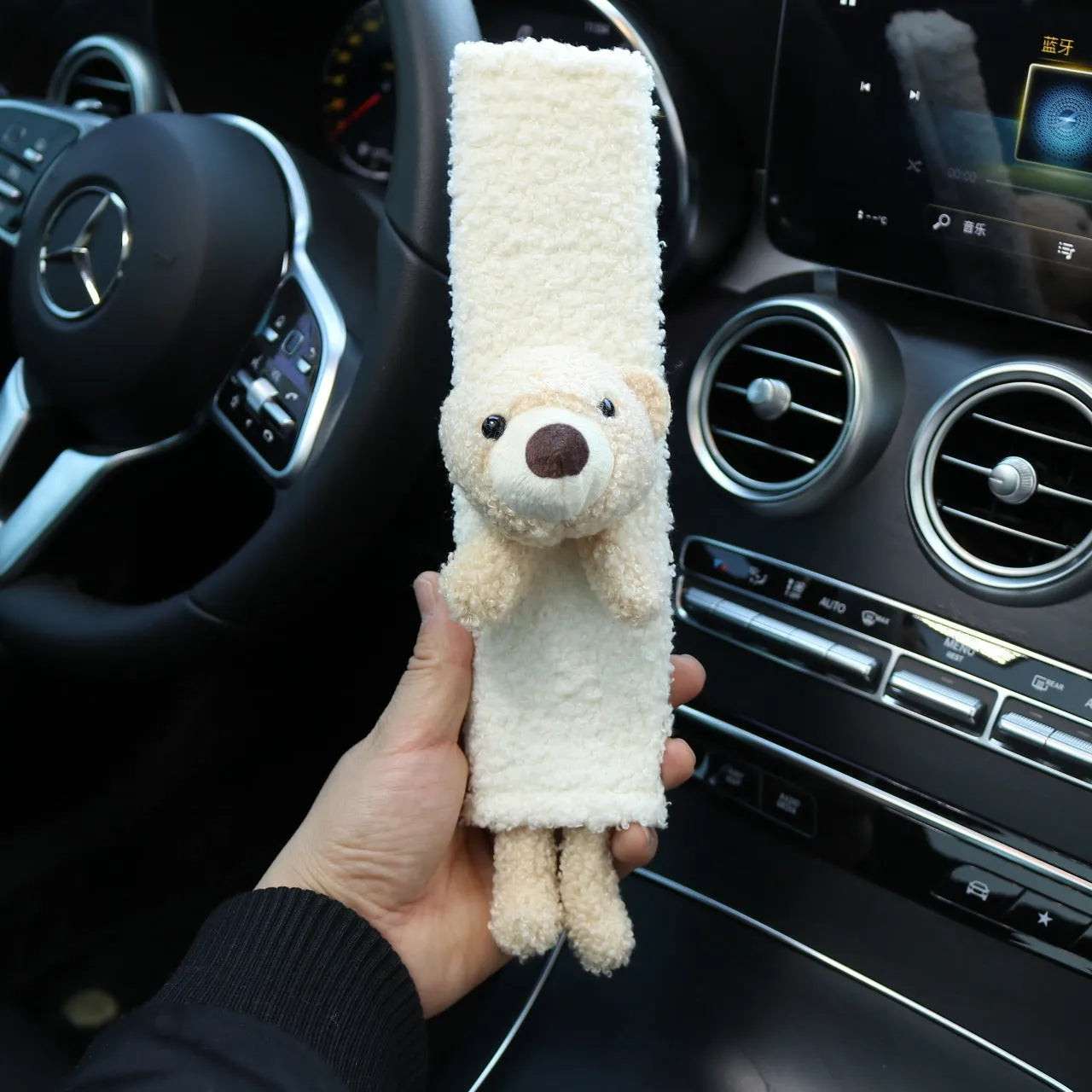 Cartoon plush lamb's wool shoulder protector for car seat belt in rabbit and bear designs.