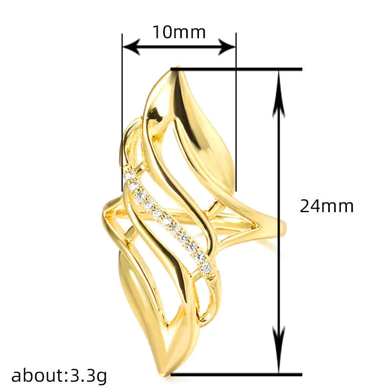 Women's gold-colour ring with exaggerated curved design on finger, showing profile and zircon finish