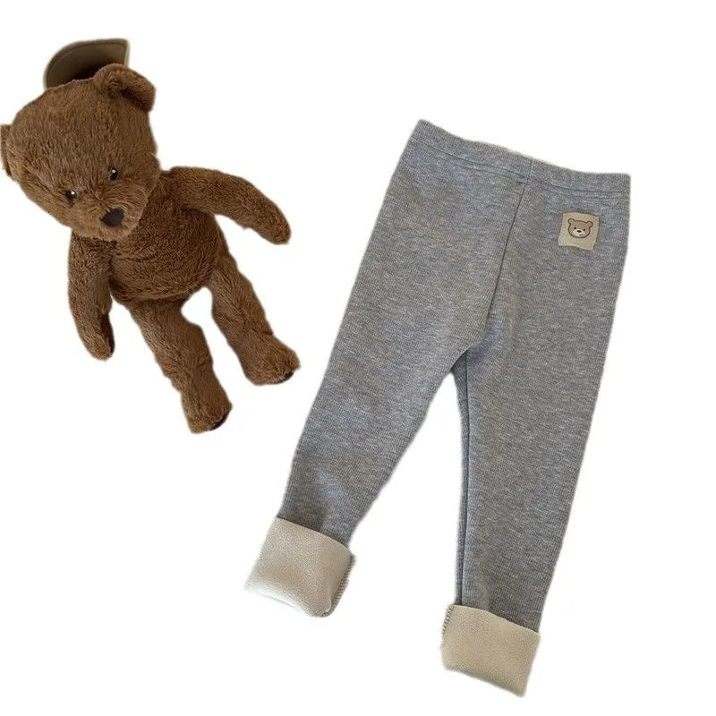 Girls' high-waist fleece-lined leggings in beige, shown with elastic hairband belt detail.