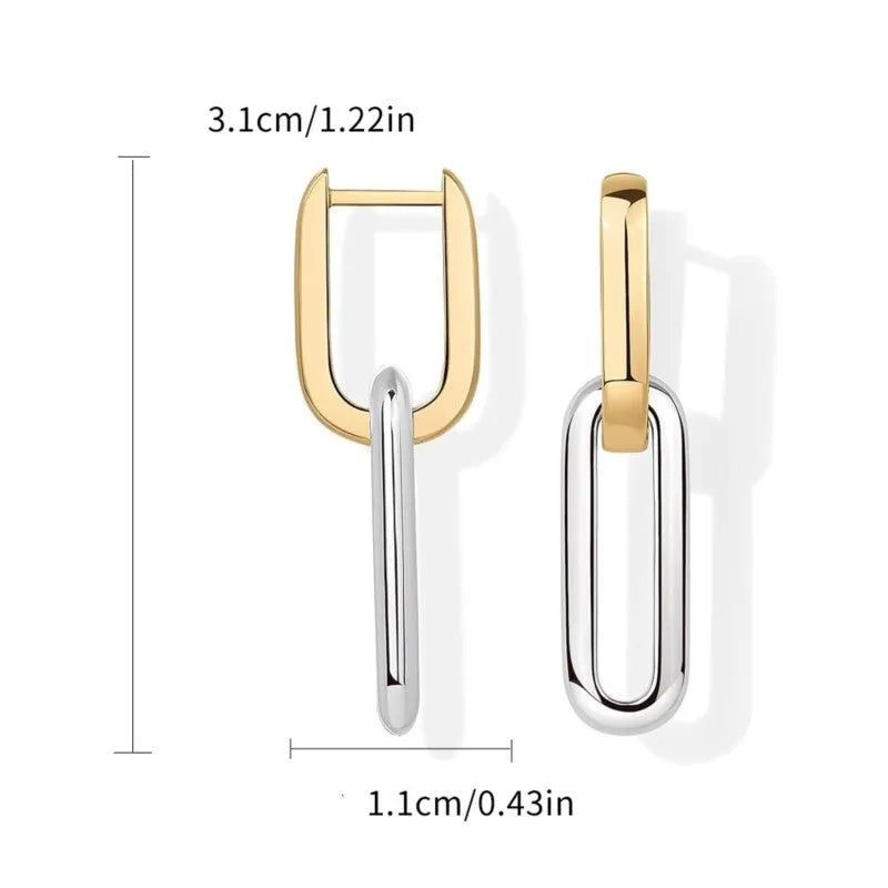 14K gold and silver two-tone geometric U-shaped earrings on a light background showing the copper core and metallic finish